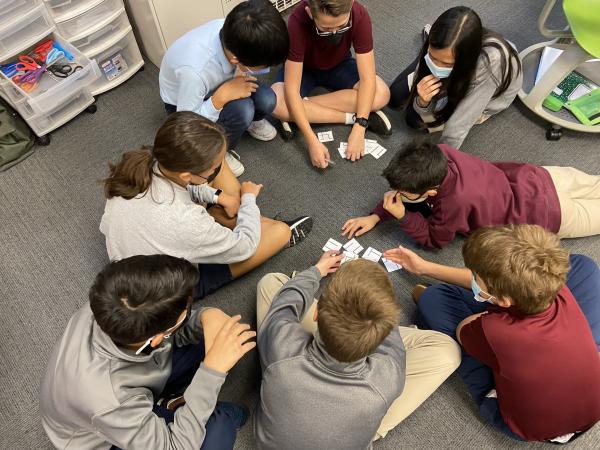 Columbus Academy Middle School Students gather on floor for a group activity