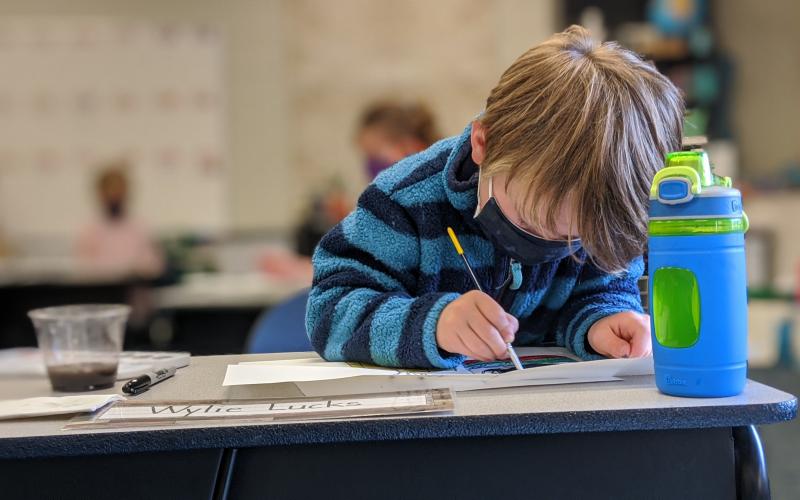 Boy painting at Columbus Academy