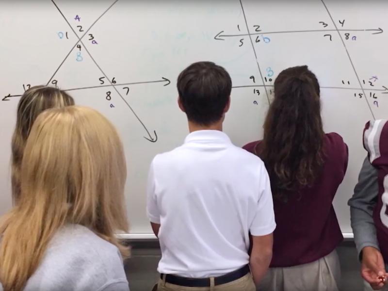 students work on math problem together