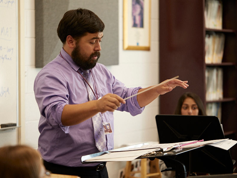 Columbus Academy music teacher conducting